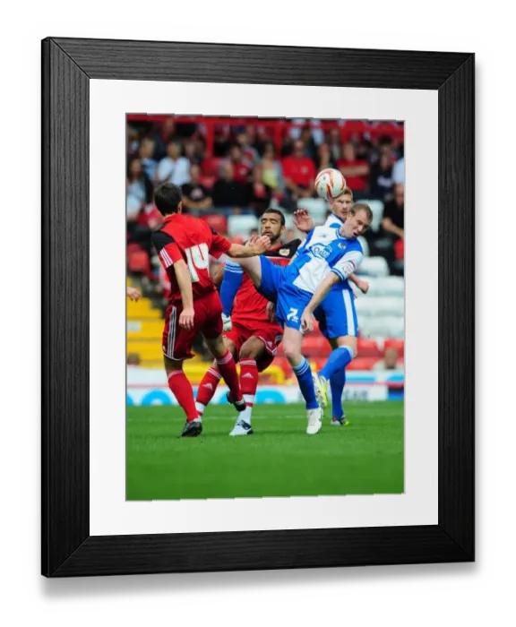 Framed Print : Battling for the High Ball: Liam Fontaine vs. David Clarkson - Bristol City vs. Bristol Rovers, 2012