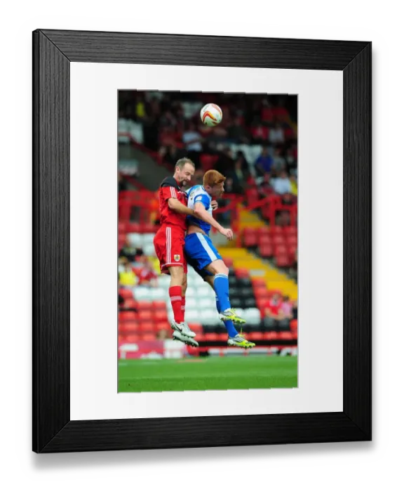Framed Print : Louis Carey vs Matt Harold: Intense Rivalry in the Bristol Derby Pre-Season Friendly at Ashton Gate Stadium, 2012