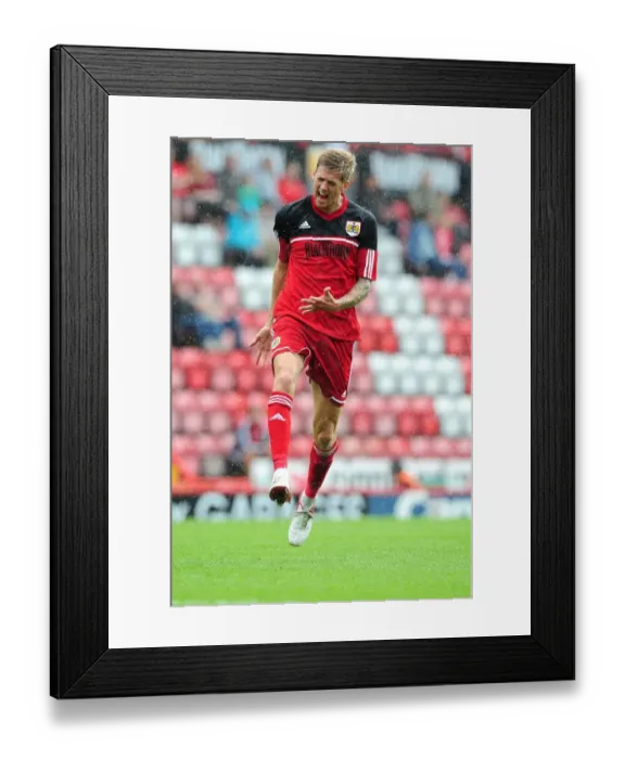 Framed Print : Frustration on the Field: A Tense Moment at the Louis Carey Testimonial, Bristol City vs. Bristol Rovers (2012)