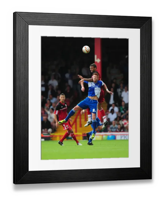 Framed Print : Battling for Height: Fontaine vs. Harold - A Football Rivalry Unfolds at Ashton Gate, 2012
