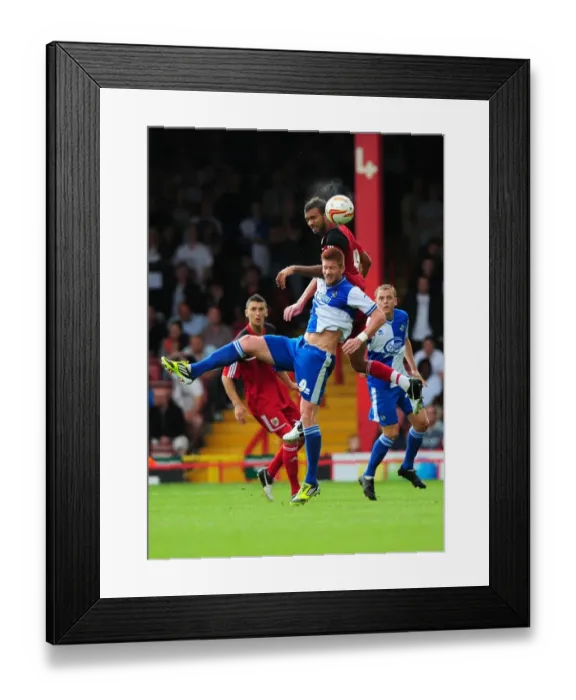 Framed Print : Battling for Height: A Football Rivalry - Liam Fontaine vs. Matt Harold at the Louis Carey Testimonial (August 4, 2012)