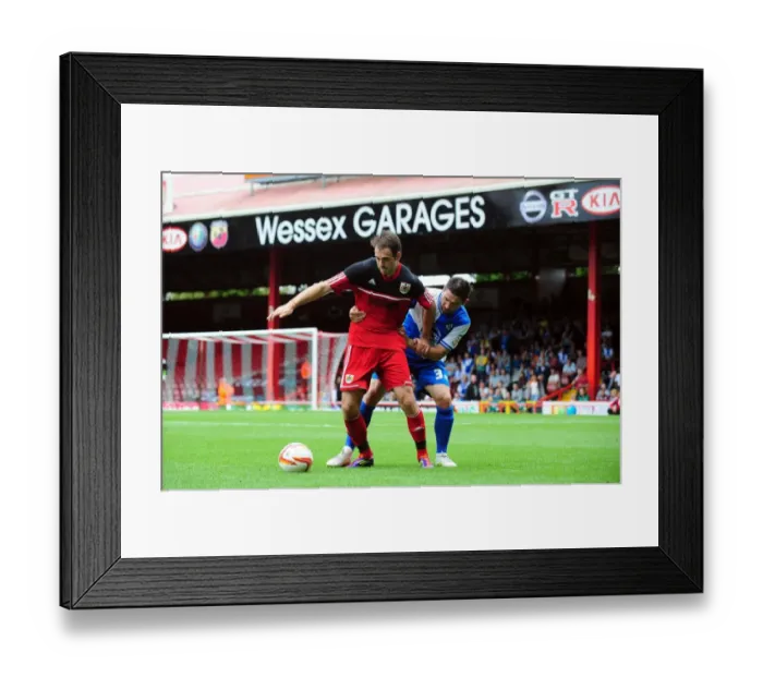 Framed Print : Battling for the Ball: Brett Pitman vs. Jim Paterson - Bristol City vs. Bristol Rovers, 2012 (Louis Carey Testimonial)