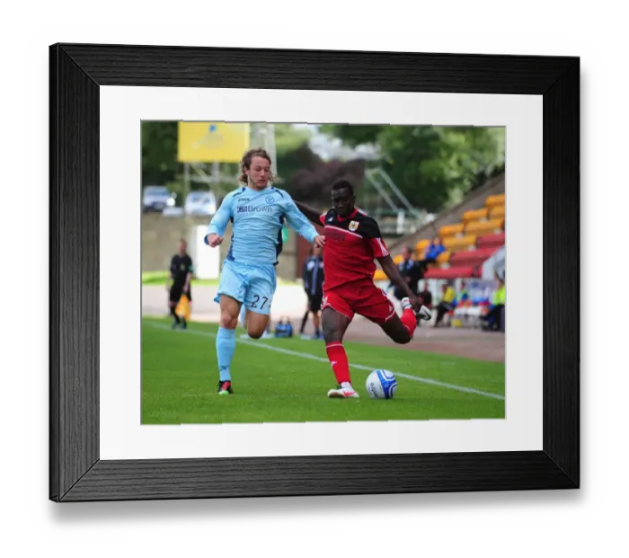 Framed Print : Yannick Bolasie's Cross: A Pre-Season Moment at McDiarmid Park (St Johnstone vs. Bristol City) Framed Print : Yannick Bolasie's Cross: A Pre-Season Moment at McDiarmid Park (St Johnstone vs. Bristol City)