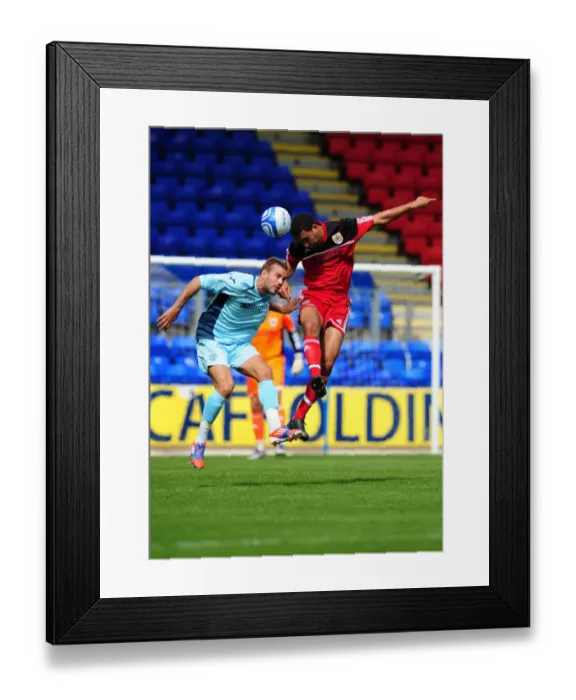 Framed Print : Bristol City's Lewin Nyatanga Wins the High Ball in Pre-Season Friendly against St Johnstone Framed Print : Bristol City's Lewin Nyatanga Wins the High Ball in Pre-Season Friendly against St Johnstone