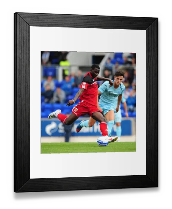 Framed Print : Yannick Bolasie's Long-Range Shot: St Johnstone vs. Bristol City Pre-Season Friendly, 2012 Framed Print : Yannick Bolasie's Long-Range Shot: St Johnstone vs. Bristol City Pre-Season Friendly, 2012