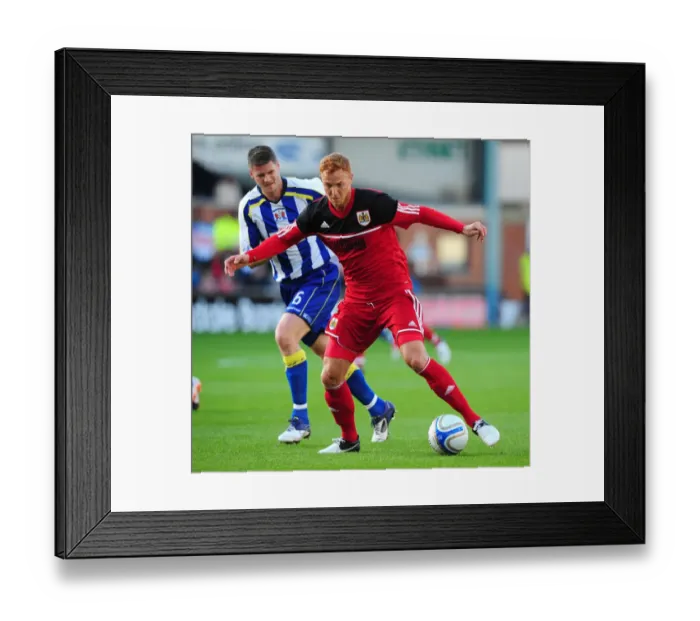 Framed Print : Ryan Taylor Charges Forward in Pre-Season Action: Bristol City's Midfielder Makes His Move