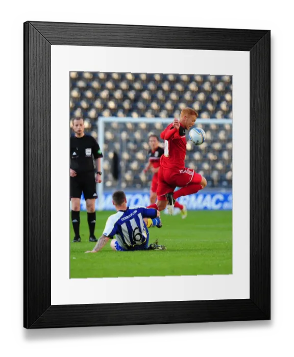 Framed Print : Battling for the Ball: Ryan Taylor vs Michael Nelson - Pre-Season Clash