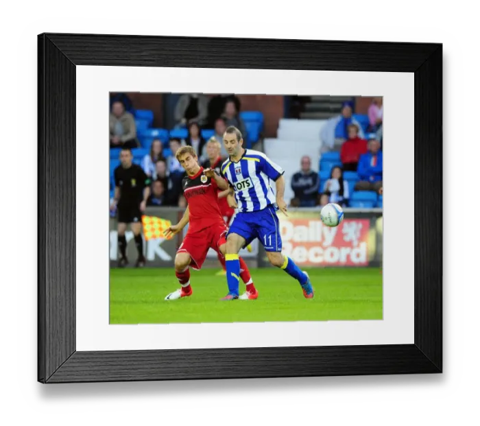 Framed Print : Battling for Supremacy: Joe Bryan vs. Gary Harkins in Kilmarnock vs. Bristol City Pre-Season Clash Framed Print : Battling for Supremacy: Joe Bryan vs. Gary Harkins in Kilmarnock vs. Bristol City Pre-Season Clash