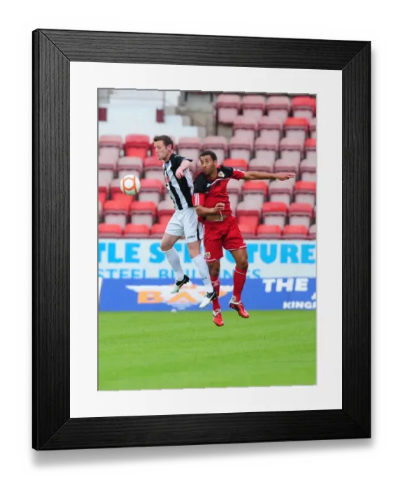Framed Print : Bristol City's Lewin Nyatanga vs. Andy Kirk: Aerial Battle in Dunfermline Friendly Framed Print : Bristol City's Lewin Nyatanga vs. Andy Kirk: Aerial Battle in Dunfermline Friendly