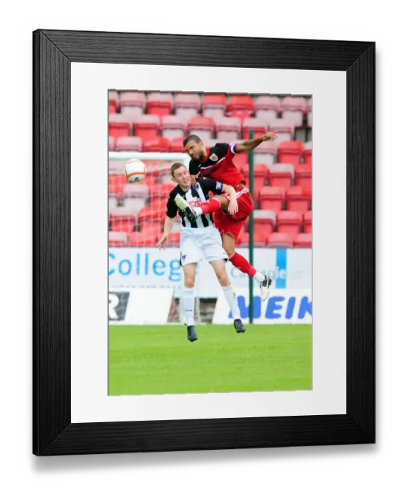 Framed Print : Bristol City's Liam Fontaine Fights for Ball Against Dunfermline's Paul Willis in Pre-Season Friendly Framed Print : Bristol City's Liam Fontaine Fights for Ball Against Dunfermline's Paul Willis in Pre-Season Friendly