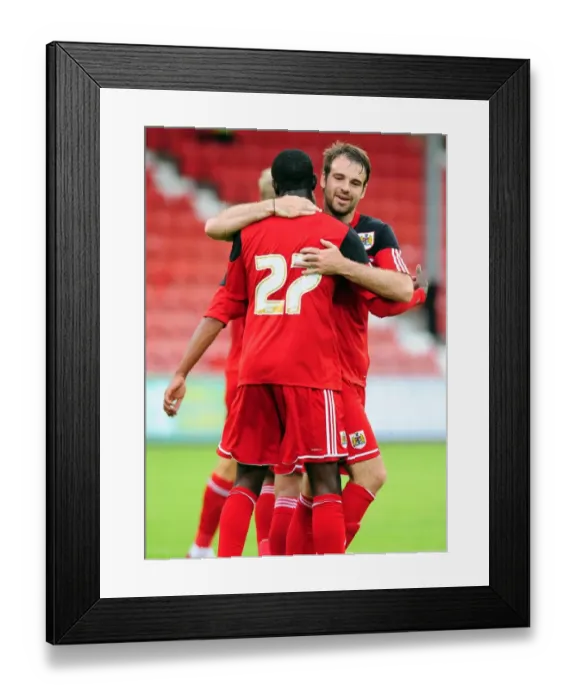 Framed Print : Bristol City Celebrates Double Strike: Albert Adomah and Brett Pitman Rejoice after Goals vs. Dunfermline Athletic (August 1, 2012)