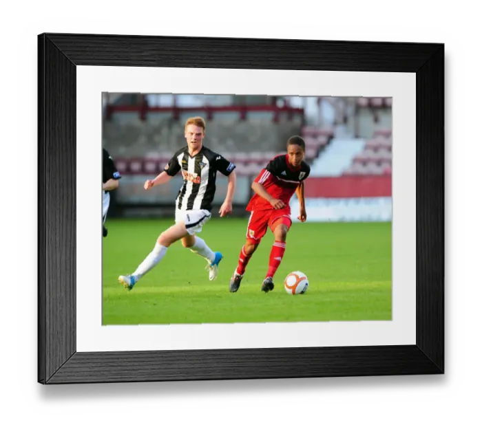 Framed Print : Bobby Reid in Action: A Thrilling Pre-Season Football Moment at Dunfermline's East End Park