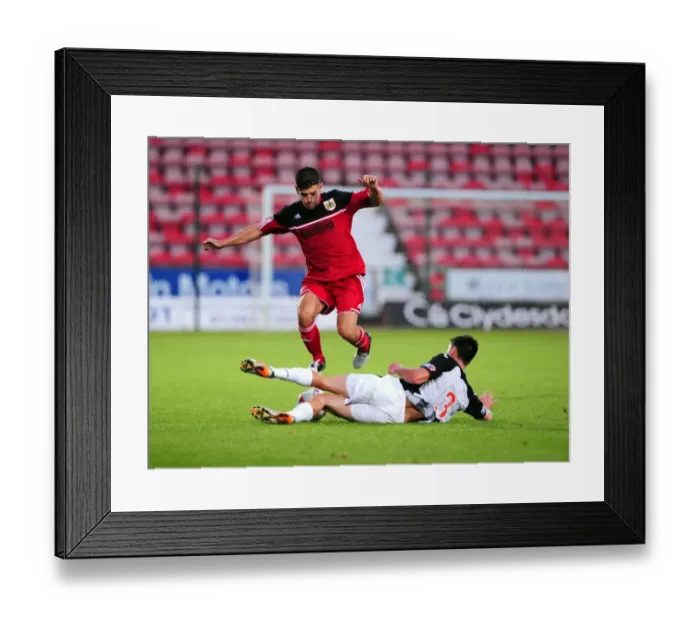 Framed Print : Bristol City's Joe Edwards Tackled in Pre-Season Friendly Against Dunfermline Athletic Framed Print : Bristol City's Joe Edwards Tackled in Pre-Season Friendly Against Dunfermline Athletic
