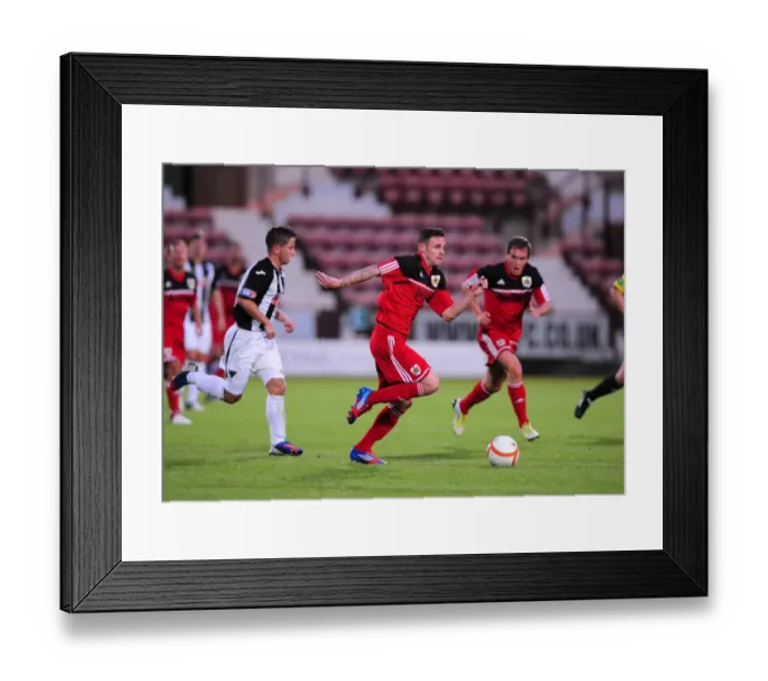 Framed Print : Paul Anderson Bolts Past Defenders in Pre-Season Friendly: Dunfermline vs. Bristol City