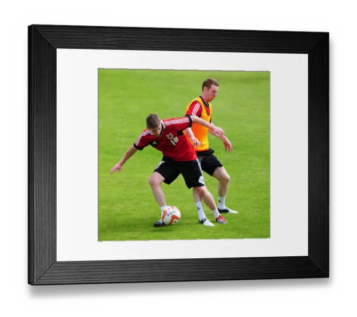 Framed Print : Bristol City Football Club: Wilson vs. Pearson - A Battle for the Ball during Pre-Season Training Framed Print : Bristol City Football Club: Wilson vs. Pearson - A Battle for the Ball during Pre-Season Training