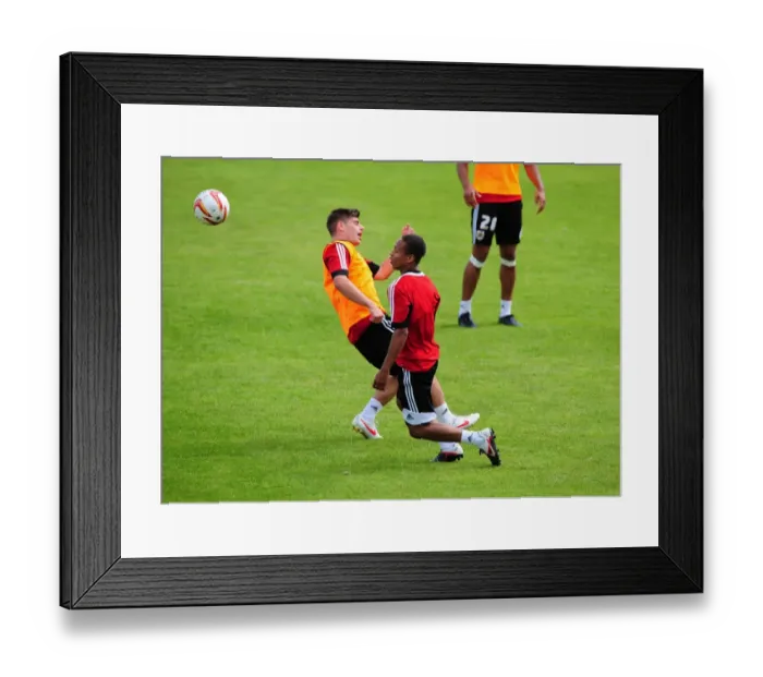 Framed Print : Bobby Reid Soars Over Joe Edwards: A Moment from Bristol City's Pre-Season Training, 2012