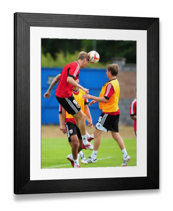Framed Print : Bristol City Football Club: Jon Stead vs Joe Bryan - Aerial Battle in Pre-Season Training, 2012