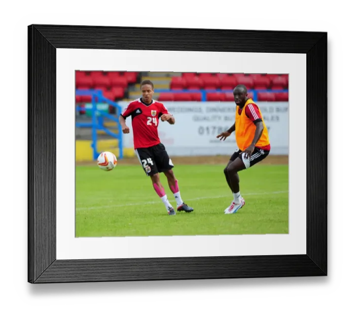 Framed Print : Intense Training Showdown: Bobby Reid vs. Damion Stewart - A Battle for the Ball Framed Print : Intense Training Showdown: Bobby Reid vs. Damion Stewart - A Battle for the Ball