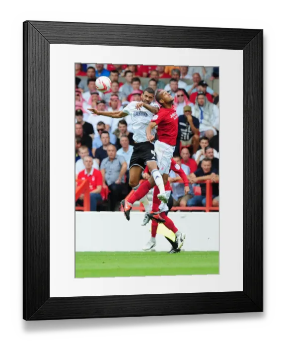 Framed Print : Battling for Supremacy: Liam Fontaine vs. Dexter Blackstock in Nottingham Forest vs. Bristol City Championship Clash