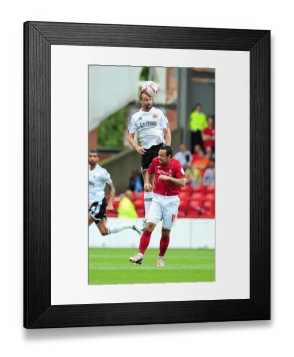 Framed Print : Battling for Supremacy: Carey vs. Reid in Nottingham Forest vs. Bristol City Championship Clash