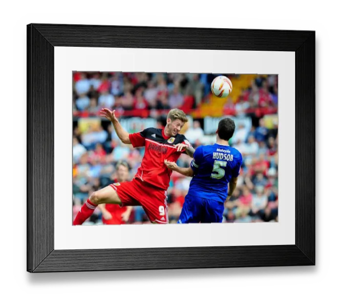 Framed Print : Battling for Supremacy: Jon Stead vs Mark Hudson in the Bristol City vs Cardiff City Championship Clash