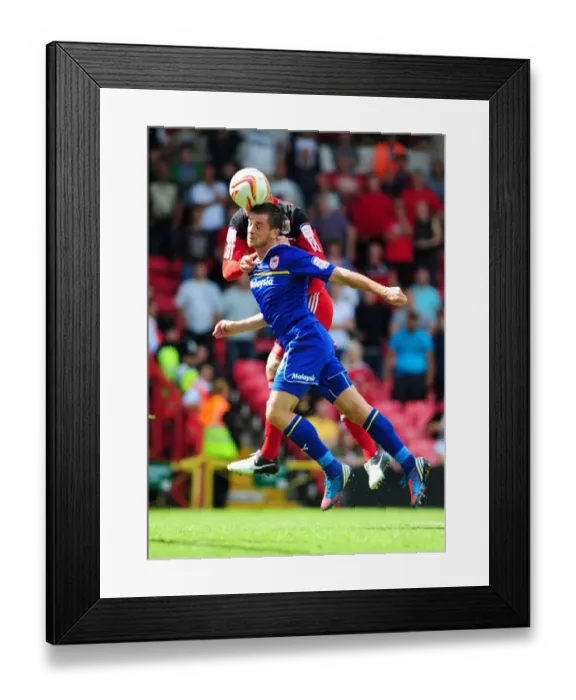 Framed Print : Bristol City vs. Cardiff City: Ryan Taylor Seizes the Ball Over Andrew Taylor