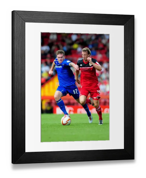 Framed Print : Bristol City vs Cardiff City: Intense Battle for Possession - Martyn Woolford vs Aron Gunnarsson