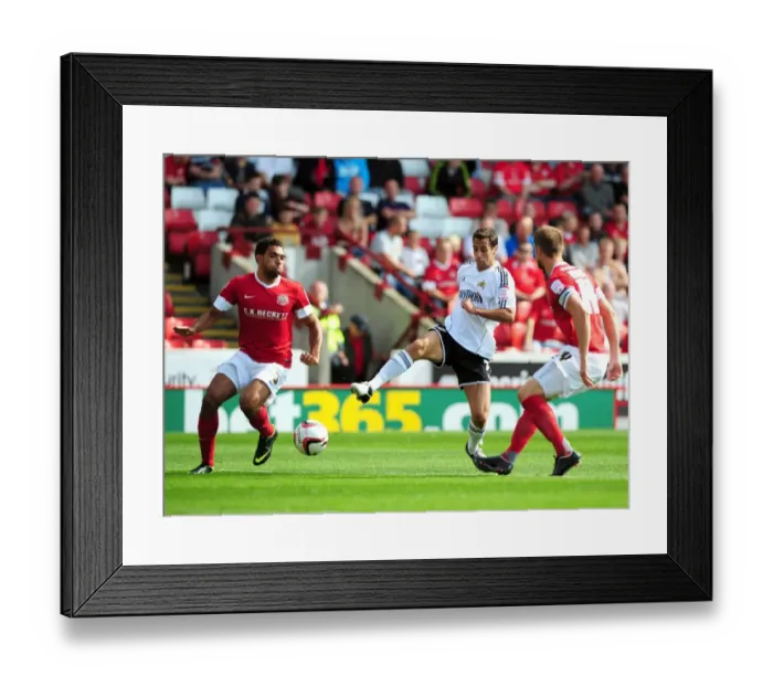 Framed Print : Bristol City's Sam Baldock Tries to Squeeze Past Barnsley's Defenders Framed Print : Bristol City's Sam Baldock Tries to Squeeze Past Barnsley's Defenders