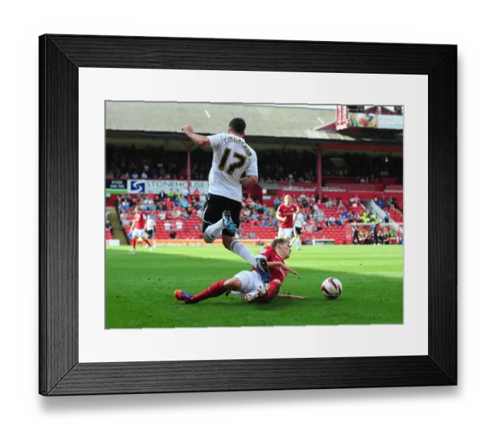 Framed Print : Barnsley's John Stones Tackles Martyn Woolford in Championship Clash Framed Print : Barnsley's John Stones Tackles Martyn Woolford in Championship Clash