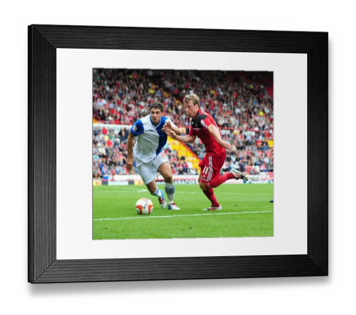Framed Print : Intense Rivalry: Woolford vs. Orr - A Battle for the Ball in the Bristol City vs. Blackburn Rovers Championship Clash