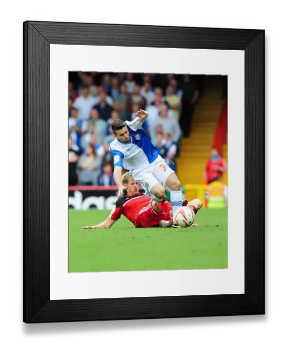 Framed Print : Intense Championship Clash: Jon Stead vs. Bruno Ribeiro - A Hard-Fought Tackle
