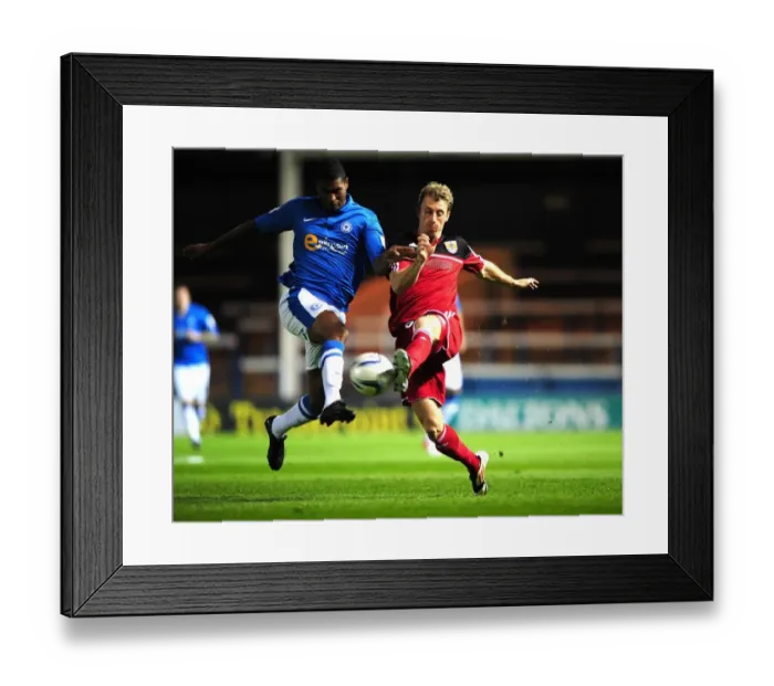 Framed Print : Battling for Supremacy: Woolford vs. Little in Peterborough United vs. Bristol City Championship Clash