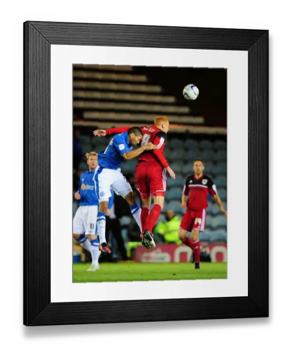 Framed Print : Battling for Supremacy: Ryan Taylor vs. Nat Knight-Percival in Peterborough United vs. Bristol City Championship Clash Framed Print : Battling for Supremacy: Ryan Taylor vs. Nat Knight-Percival in Peterborough United vs. Bristol City Championship Clash