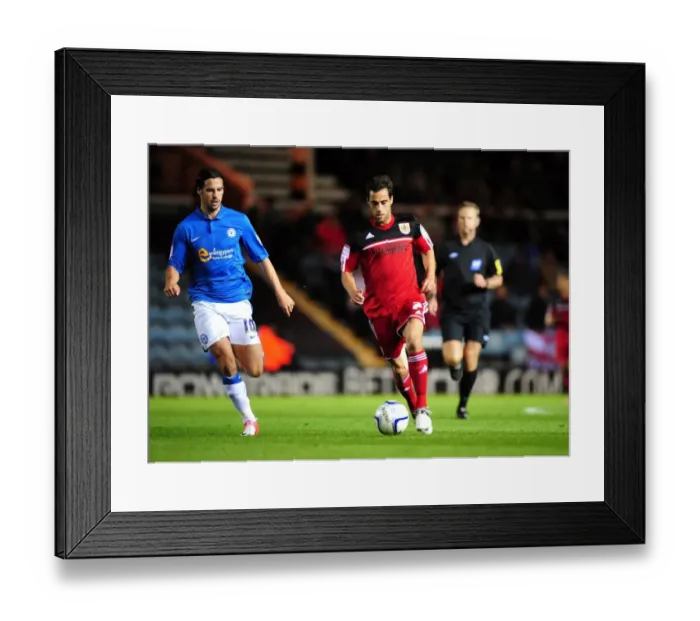 Framed Print : Bristol City's Sam Baldock Dashes Past George Boyd of Peterborough United in Championship Clash Framed Print : Bristol City's Sam Baldock Dashes Past George Boyd of Peterborough United in Championship Clash