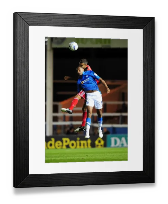 Framed Print : Bristol City's Liam Fontaine vs. Tyrone Barnett in Intense Aerial Battle during Peterborough United vs. Bristol City Championship Match Framed Print : Bristol City's Liam Fontaine vs. Tyrone Barnett in Intense Aerial Battle during Peterborough United vs. Bristol City Championship Match
