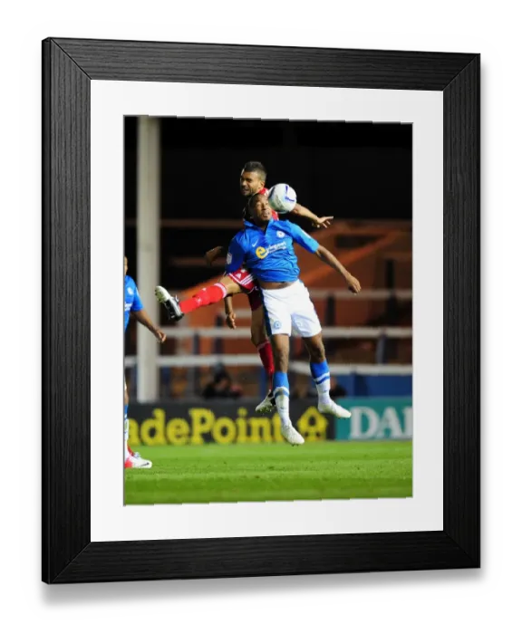 Framed Print : Intense Aerial Battle: Liam Fontaine vs. Tyrone Barnett, Peterborough United vs. Bristol City Championship Match Framed Print : Intense Aerial Battle: Liam Fontaine vs. Tyrone Barnett, Peterborough United vs. Bristol City Championship Match