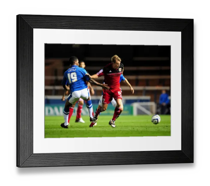 Framed Print : Bristol City's Martyn Woolford Dribbles Past Peterborough United's Mark Little in Championship Clash