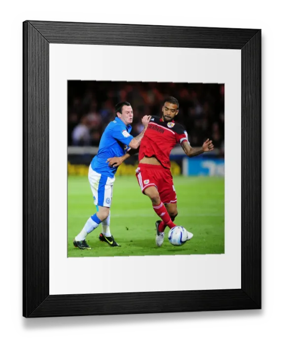 Framed Print : Bristol City's Liam Fontaine Fouls by Lee Tomlin in Peterborough United Championship Clash Framed Print : Bristol City's Liam Fontaine Fouls by Lee Tomlin in Peterborough United Championship Clash