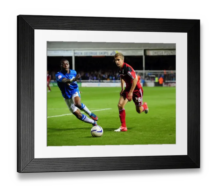 Framed Print : Bristol City's Joe Bryan Outmaneuvers Peterborough United's Gabriel Zakuani in Championship Clash Framed Print : Bristol City's Joe Bryan Outmaneuvers Peterborough United's Gabriel Zakuani in Championship Clash