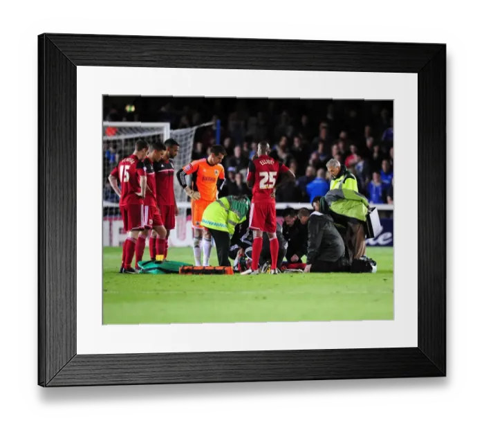 Framed Print : Bristol City's Greg Cunningham Receives Treatment During Peterborough United Match Framed Print : Bristol City's Greg Cunningham Receives Treatment During Peterborough United Match