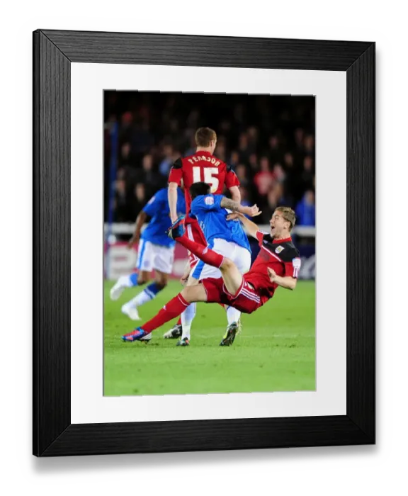 Framed Print : Bristol City's Steven Davies Fouled by Lee Tomlin in Peterborough United Championship Clash Framed Print : Bristol City's Steven Davies Fouled by Lee Tomlin in Peterborough United Championship Clash