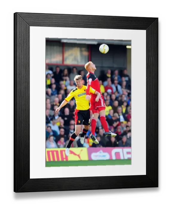 Framed Print : Battling for Supremacy: Ryan Taylor vs. Neuton in the Championship Clash between Watford and Bristol City
