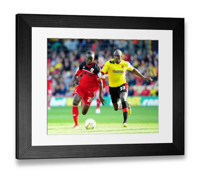 Framed Print : Adomah vs. Nosworthy: Intense Battle for Ball Possession in Watford vs. Bristol City Championship Clash Framed Print : Adomah vs. Nosworthy: Intense Battle for Ball Possession in Watford vs. Bristol City Championship Clash