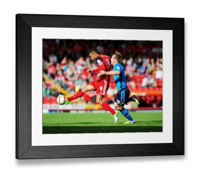 Framed Print : Bristol City's Liam Fontaine Clears Ball from Luciano Becchio in Championship Clash Framed Print : Bristol City's Liam Fontaine Clears Ball from Luciano Becchio in Championship Clash