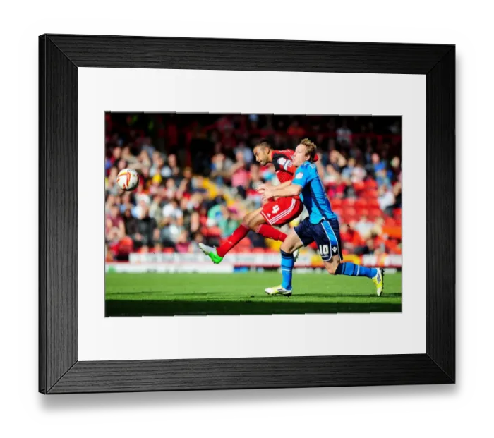 Framed Print : Bristol City's Liam Fontaine Blocks Shot from Leeds United's Luciano Becchio in Championship Match