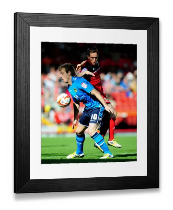 Framed Print : Battling for Supremacy: Neil Kilkenny vs. Luciano Becchio in the Championship Clash between Bristol City and Leeds United Framed Print : Battling for Supremacy: Neil Kilkenny vs. Luciano Becchio in the Championship Clash between Bristol City and Leeds United
