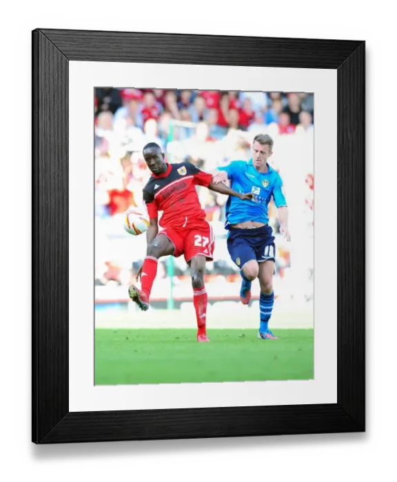 Framed Print : Adomah vs Tonge: Intense Battle for Ball Possession in Bristol City vs Leeds United Championship Clash Framed Print : Adomah vs Tonge: Intense Battle for Ball Possession in Bristol City vs Leeds United Championship Clash