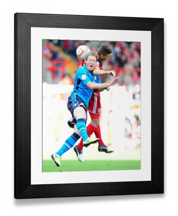 Framed Print : Bristol City vs Leeds United: Wilson vs Becchio's Aerial Battle in Championship Football Framed Print : Bristol City vs Leeds United: Wilson vs Becchio's Aerial Battle in Championship Football