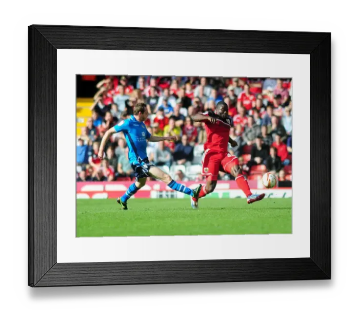 Framed Print : Bristol City vs Leeds United: George Elokobi Faces Aidan White Challenge in Championship Clash