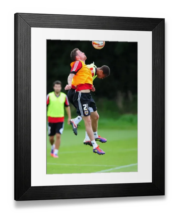 Framed Print : Bristol City Football Club: Paul Anderson and Bobby Reid Compete for High Ball during Training